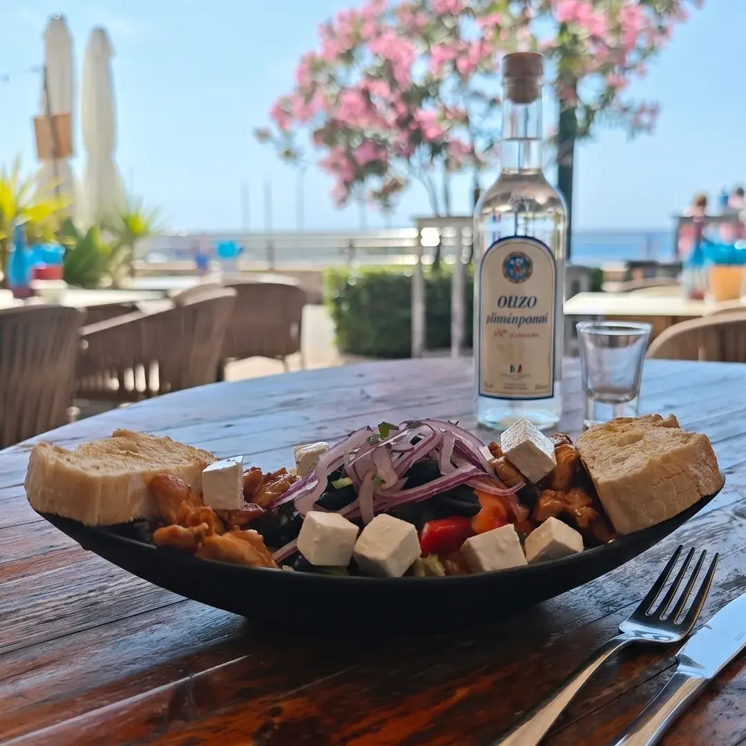 Salad and bread on a terrace table
