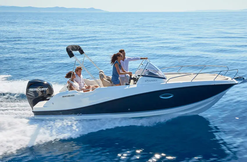 Blue-hulled motorboat with guests at sea