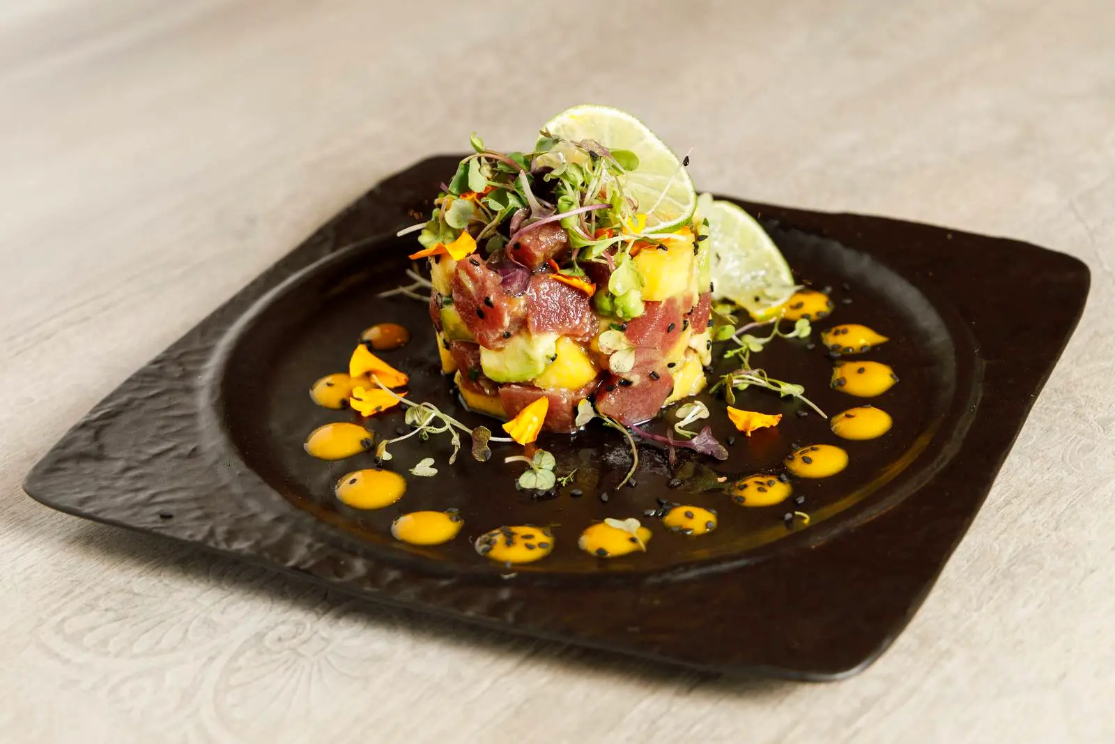 Seafood and avocado on a plate at ENCANTO