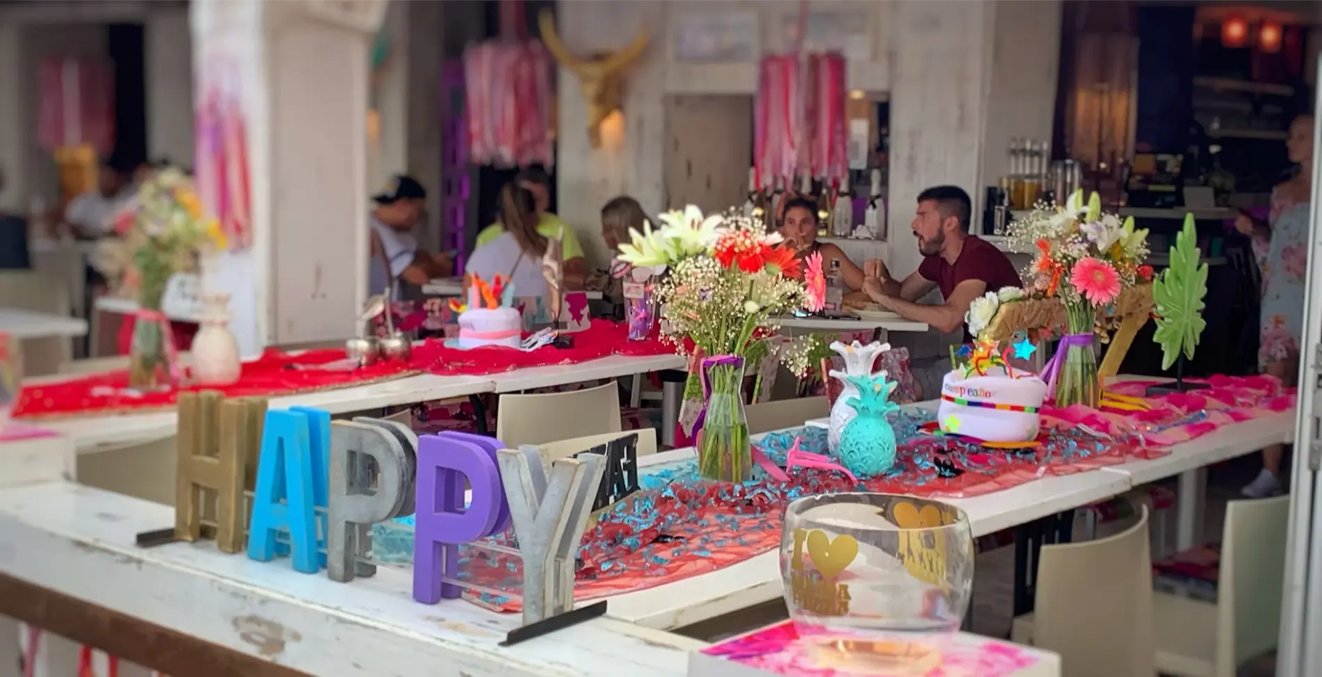 Colourful table decorations on the busy terrace