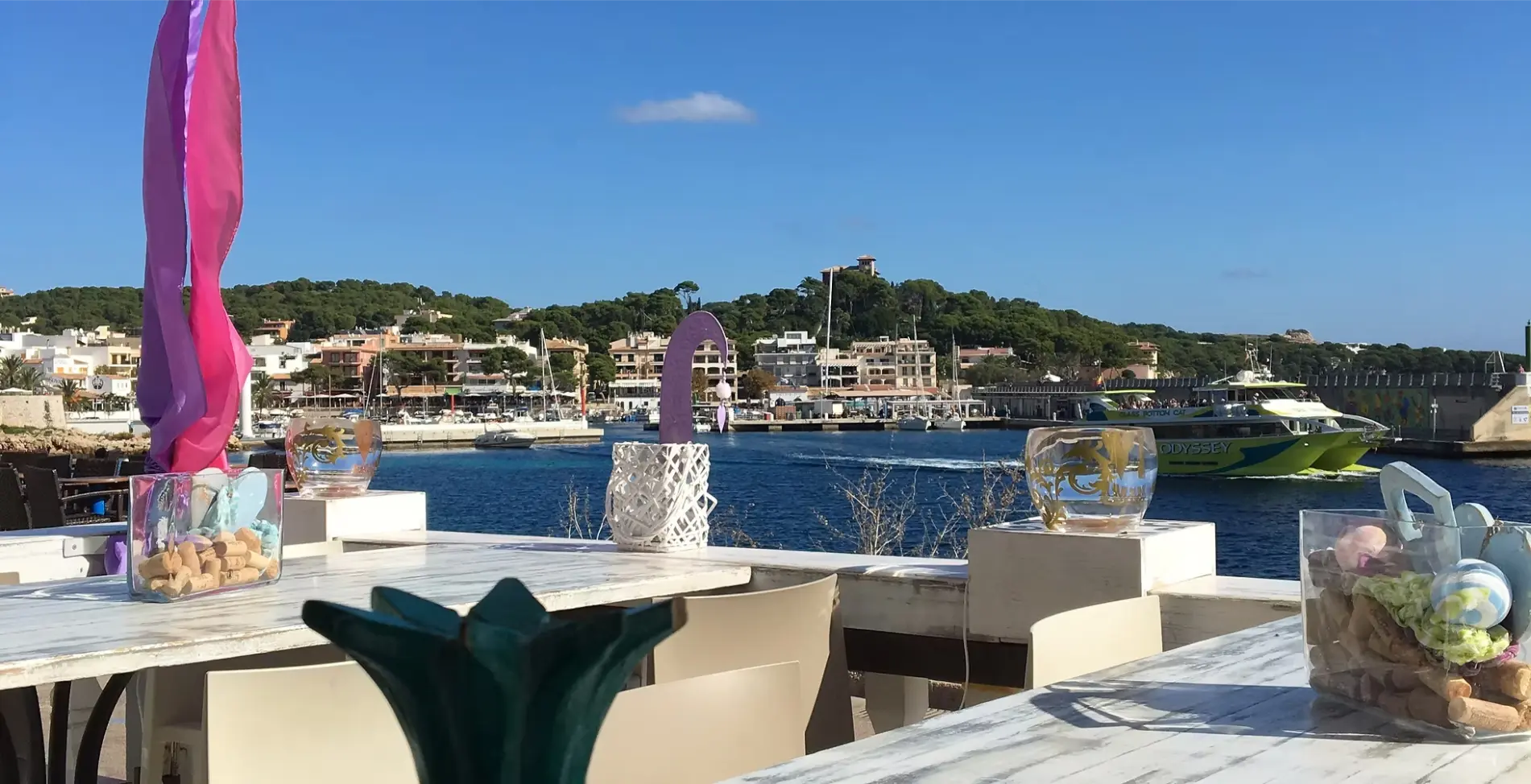 Terrace table overlooking Cala Ratjada harbour