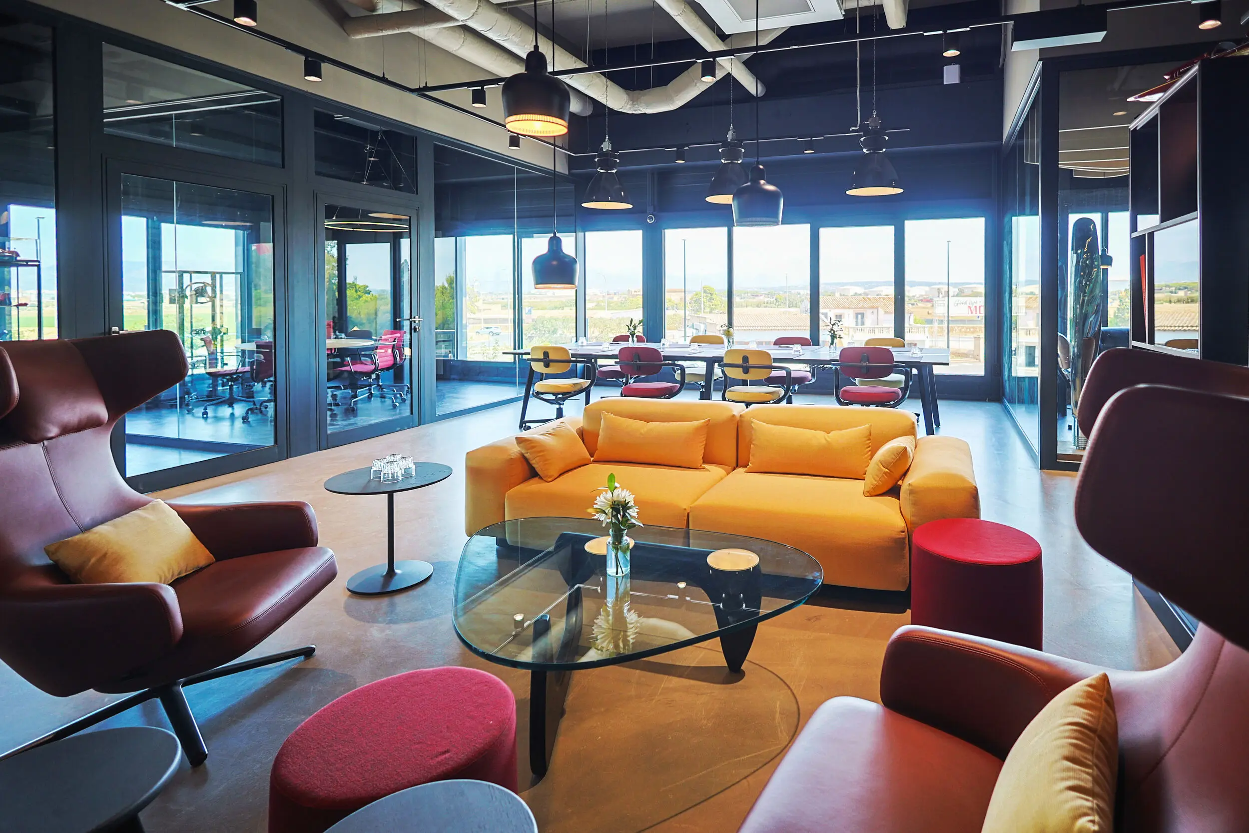 Colorful lounge and meeting area at Motorworld Mallorca