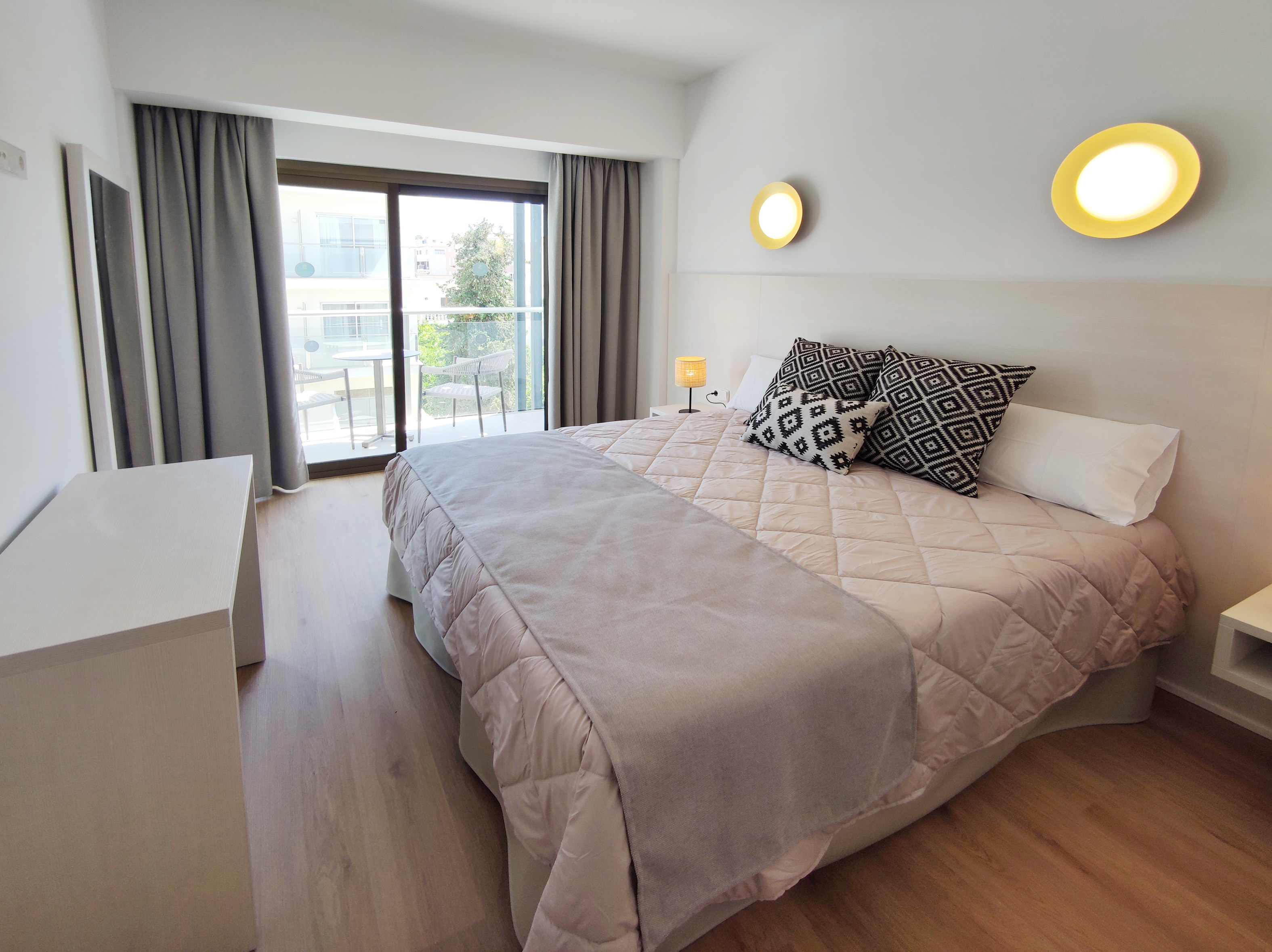 Bright Apartment bedroom with a double bed and balcony