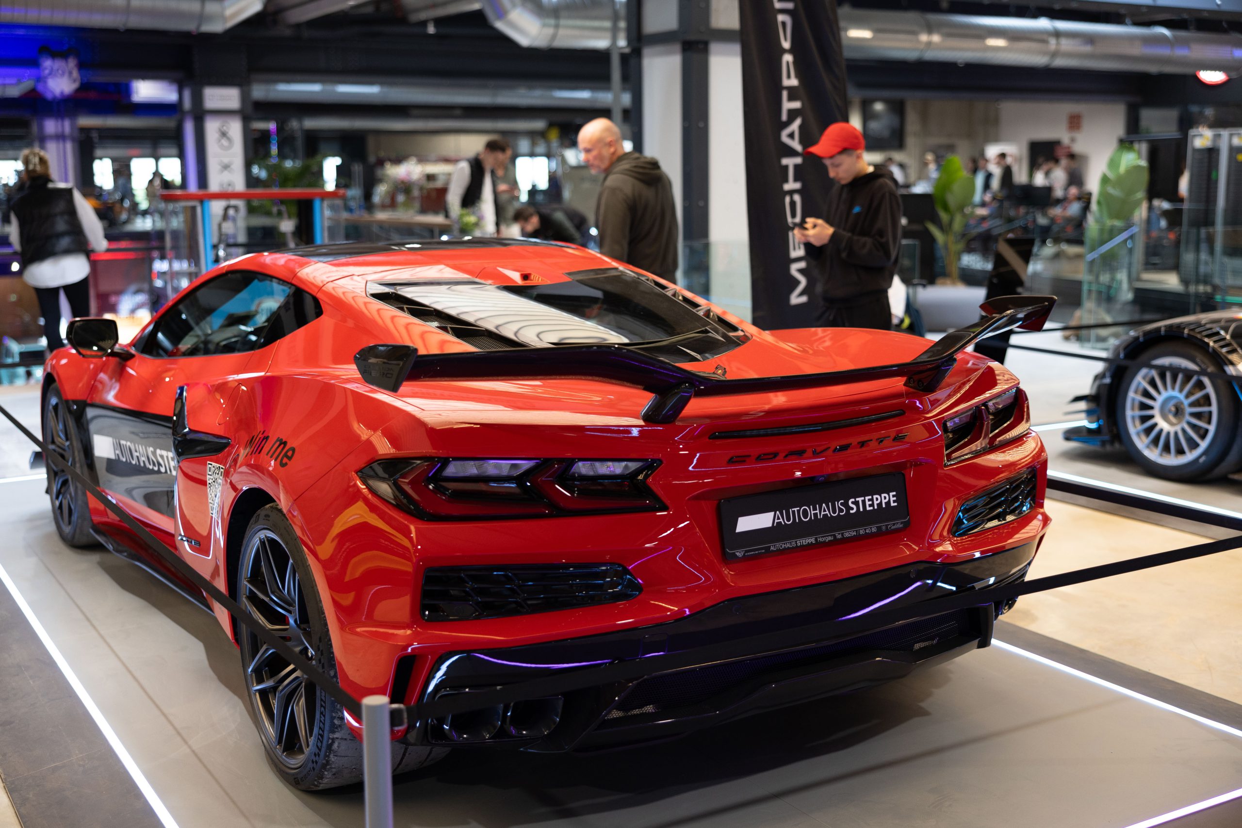 Red sports car in the Motorworld Mallorca showroom